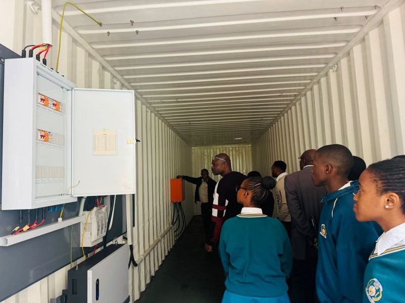 Learners from Marikana North High School receive a guided tour of the new 15kW solar power container.