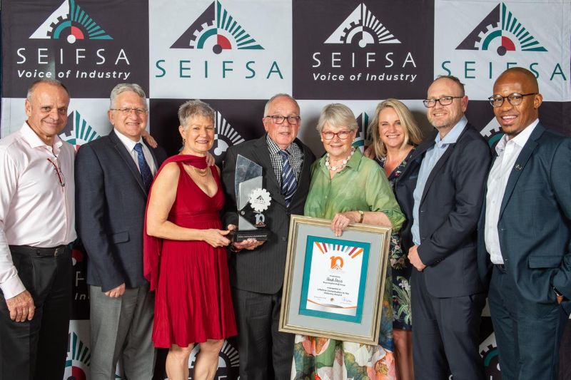 Henk Duys, past president of SEIFSA with family, friends and colleagues along with Ian Delport from Defy.