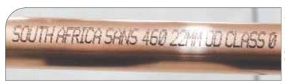 The marking on copper piping, as required by SANS 460.